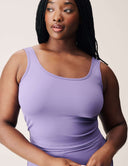 Model wearing a purple Luxe Tank Top with a classic crew neckline, showcasing a chic minimalist style.