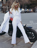 Model in white Meet Me at Noon Pant with lightweight, breathable fabric, showcasing a sleek corporate look.