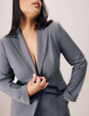 Model wearing the Perfect Form Blazer in gray, showcasing sophisticated tailoring and stylish details.