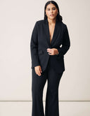 A model wearing the Perfect Form Blazer, showcasing its sophisticated tailoring and modern design.