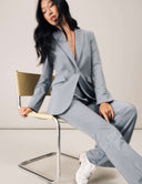 Model wearing a Perfect Form Blazer in grey, showcasing its sophisticated tailoring and versatile style.