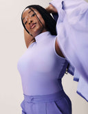 Model showcasing the Power Shift Blazer in Lavender Haze with elegant flared sleeves.