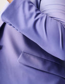Close-up of the Power Shift Blazer featuring a sophisticated design in Lavender Haze with a functional pocket.