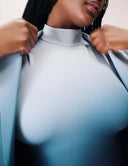 Model showcasing the Power Shift Blazer in a blue hue, emphasizing sophisticated tailoring and modern style.