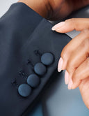 Close-up of the sleeve buttons on the Power Shift Blazer showcasing sophisticated tailoring details.