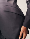 Close-up of the Power Shift Blazer showcasing the functional hip pocket and sleek tailoring.