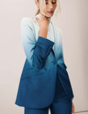 Woman wearing the Power Shift Blazer in Tidal Wave, featuring sophisticated tailoring and an ombre design.