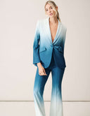 Model wearing the Power Shift Blazer in Tropical Fade with matching pants, showcasing sophisticated tailoring and modern design.