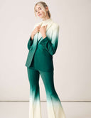 A model wearing the Power Shift Blazer in Tropical Fade, styled with matching pants for a chic look.