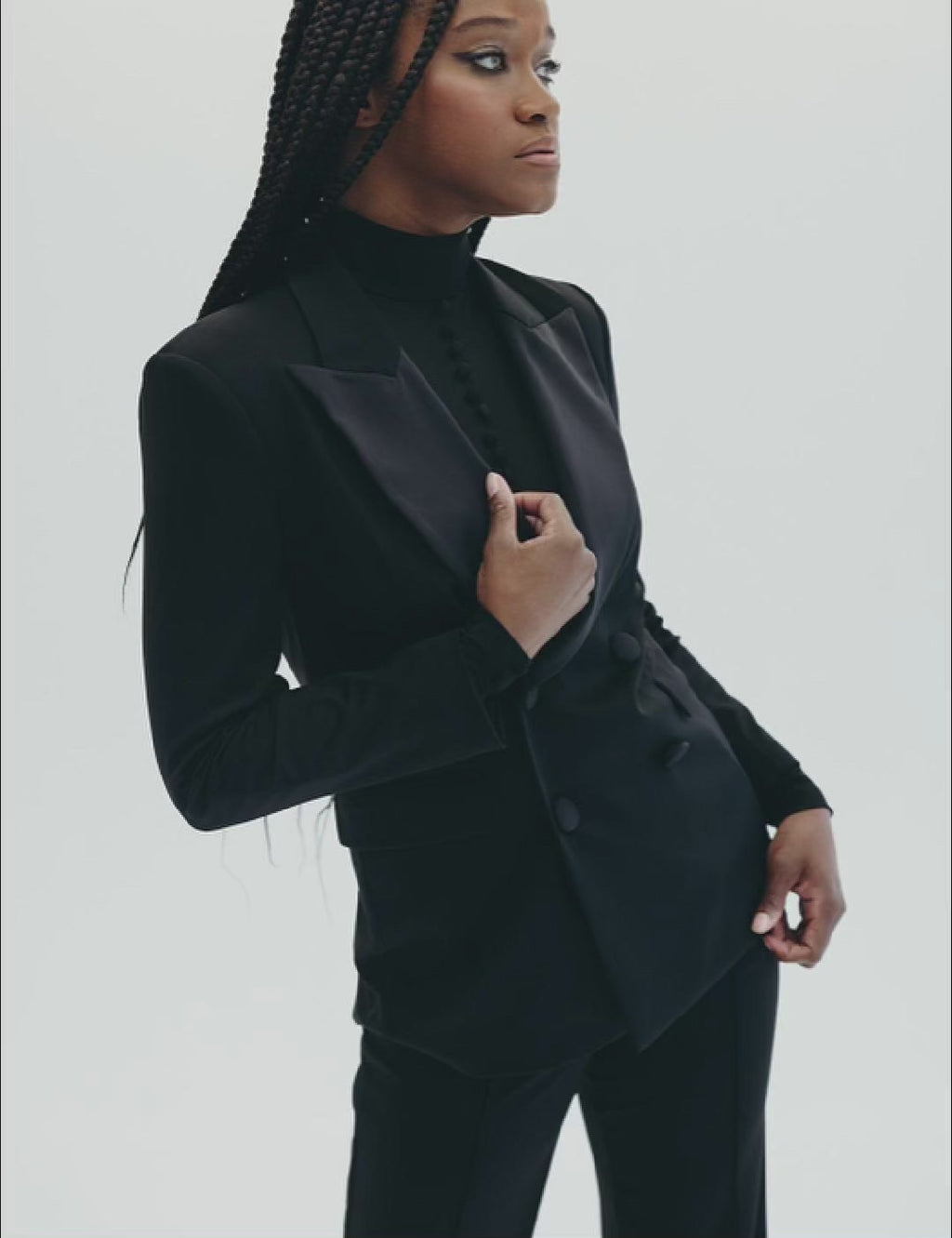 Chic oversized black tuxedo blazer for a glam look, featuring lustrous fabric and modern design.Chic oversized black tuxedo blazer for a glam look, featuring lustrous fabric and modern design.