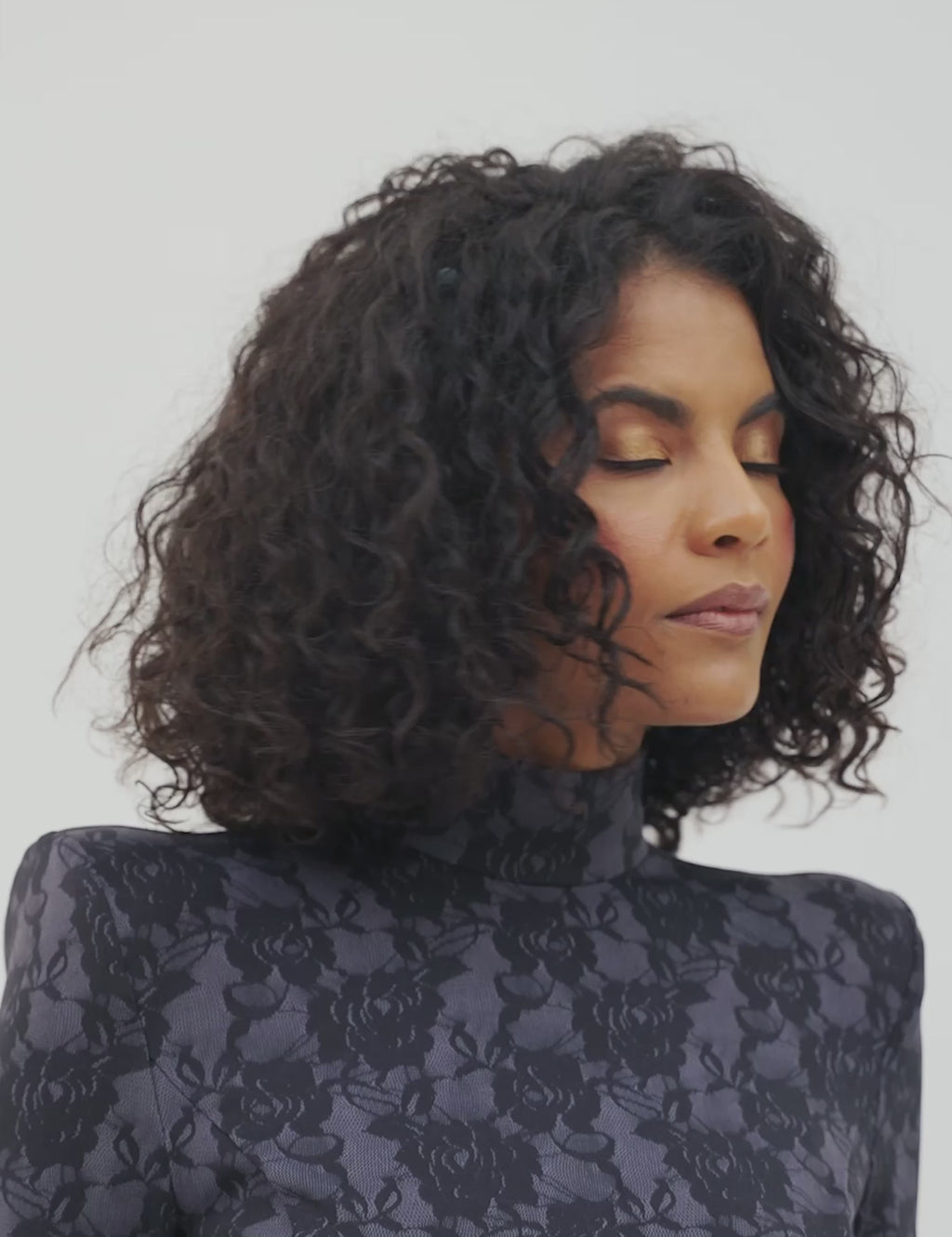 Black Widow midi dress with pointed shoulder pads, perfect for day-to-night transitions. Double lined and stylish.