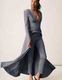 Model wearing the Promise Me Nothing Top showcasing fluid movement and structured confidence with a deep V-neckline.