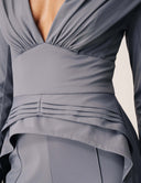 Close-up of the Promise Me Nothing Top showcasing its deep V-neckline and flattering ruching design.