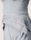 Promise Me Nothing Top showcasing structured ruching and a deep V-neckline in a soft blue fabric.