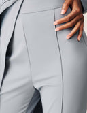 Close-up of the tapered leg and pintuck seams of the Promise Me Nothing Pant in light gray.