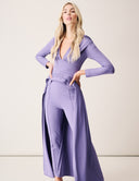 Woman wearing the Promise Me Nothing Set - Wisteria, showcasing elegant long-sleeve top and matching pants.