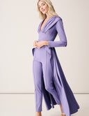 Model wearing Promise Me Nothing Set - Wisteria featuring a deep V-neckline and high-low hem.