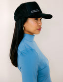 Woman wearing The Classic Cap, showcasing its stylish design and modern look.
